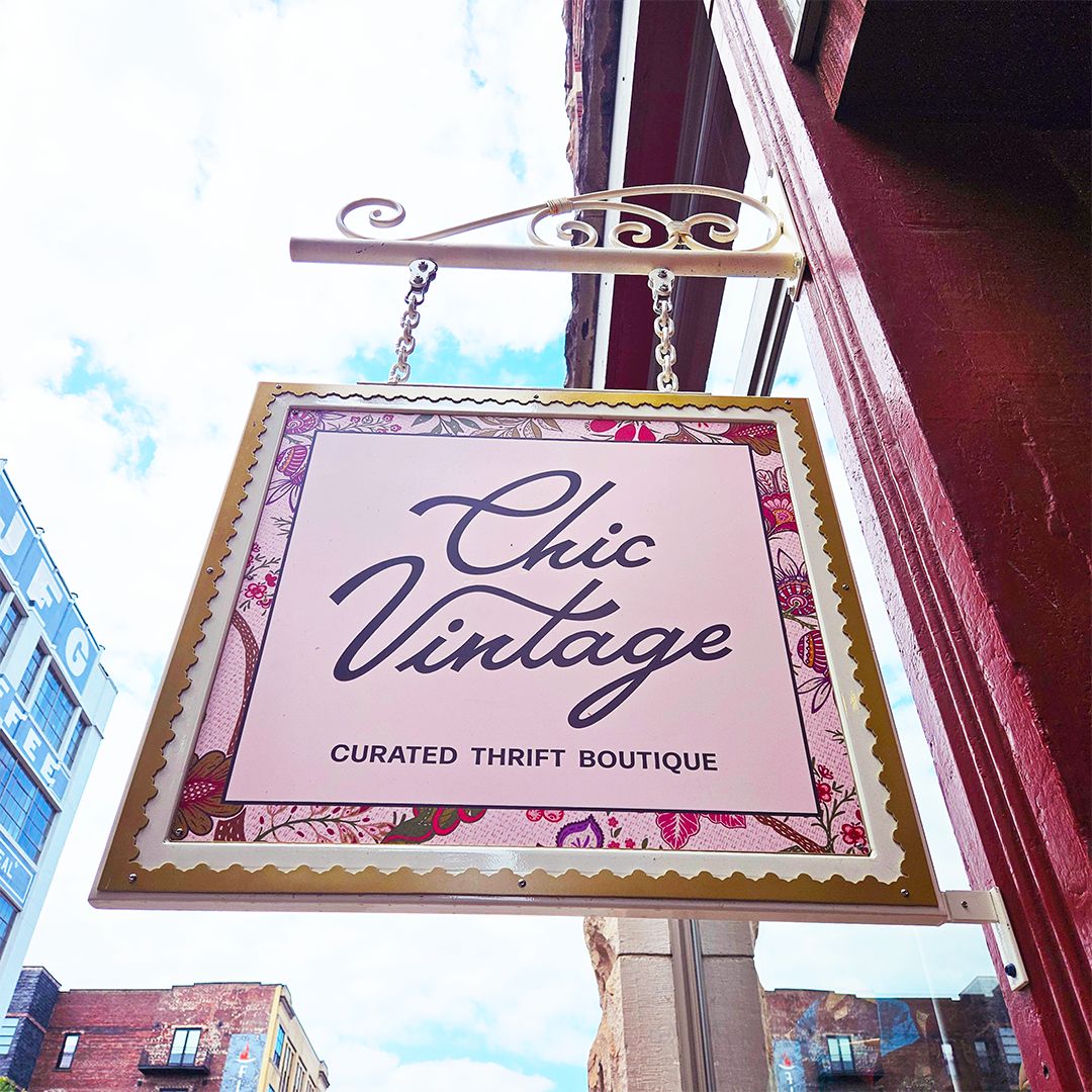 Chic Vintage hand-painted hanging sign above the boutique in Knoxville's Old City